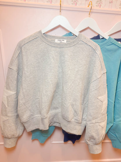 STITCHED STAR SLEEVE SWEATSHIRT