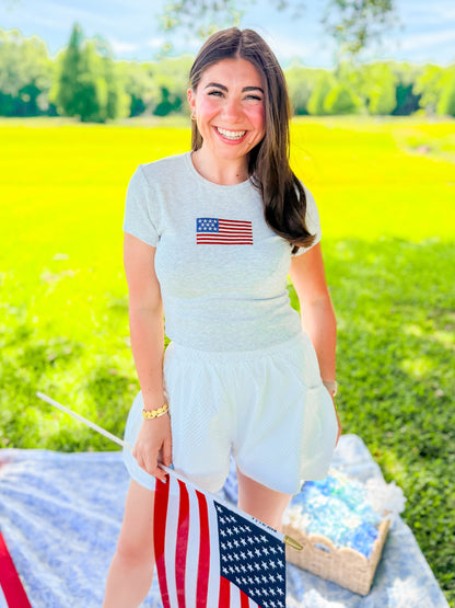 EMBROIDERED FLAG BABY TEE