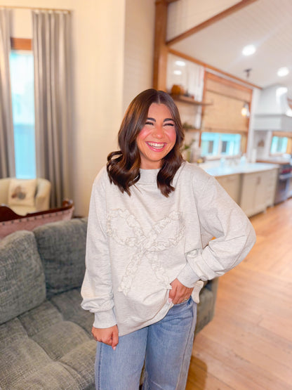 OVERSIZED SWEATSHIRT WITH RUFFLE BOW